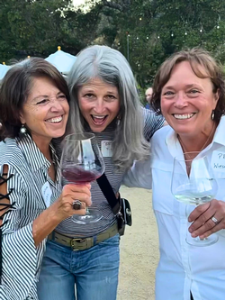 Three female club members enjoying Capo Creek wines